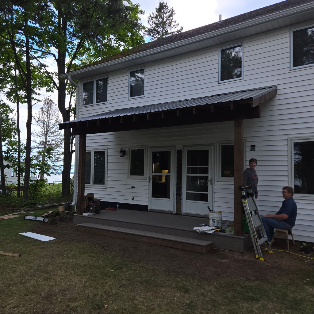 Covered porch with composite deck and metal roof