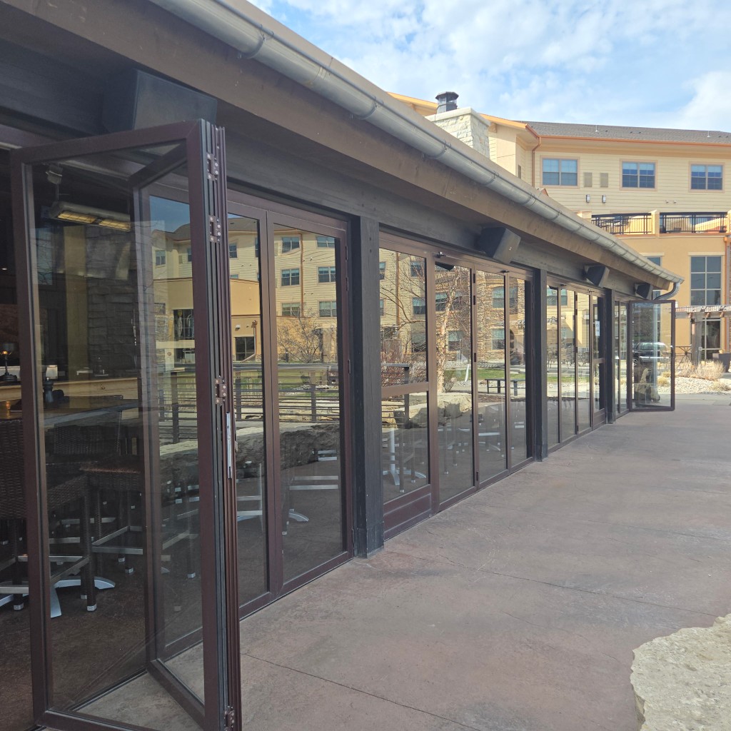NanaWall folding glass doors stacked open on patio